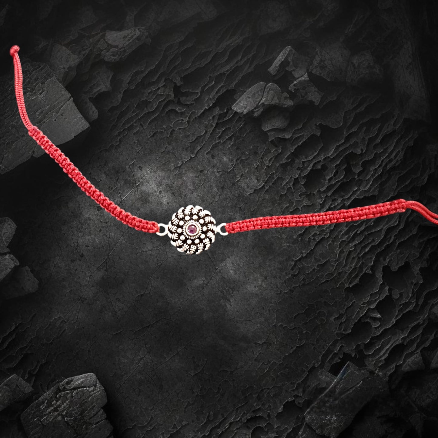 Red stone studded flower silver rakhi bracelet